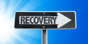 'sign that says recovery with arrow'